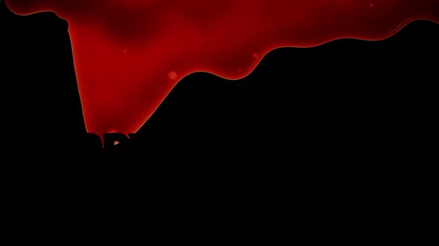 Dripping blood on black to slow reveal the words Happy Halloween and a pumpkin shape.