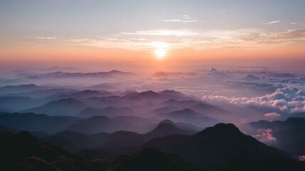 sunrise through clouds over mountain peaks, calm nature scene, no people 