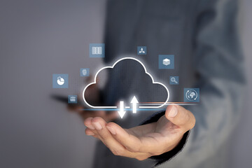 The data cloud symbol on the hand of a businessman represents global communication data storage technology.
