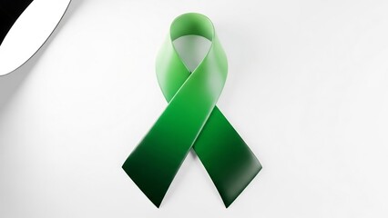 Symbol of awareness: a glossy, smooth emerald green ribbon with a subtle gradient, symbolizing support and hope, presented against a clean, softly lit background.