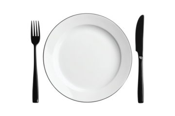 A sleek, modern table setting with a pristine white plate flanked by a black fork and knife, evoking luxury and fine dining