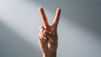 A hand making a peace sign gesture