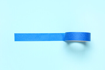 Masking tape roll on blue background