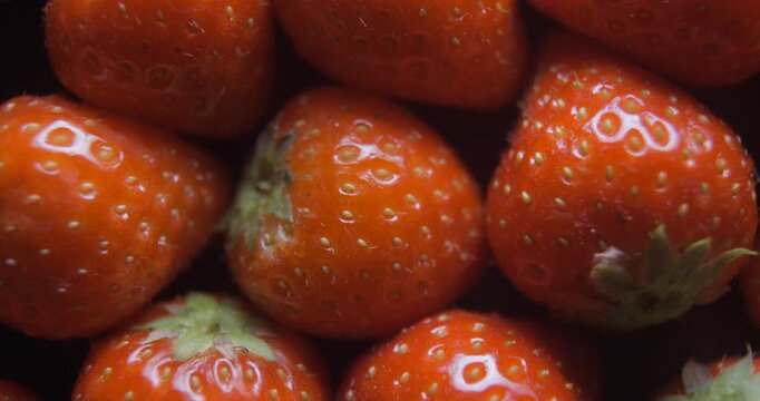 Strawberry close up studio shot over rotating
