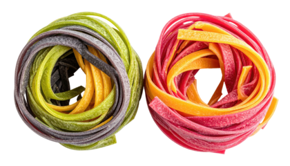 Two colorful nests of fresh tagliatelle pasta, vibrant hues