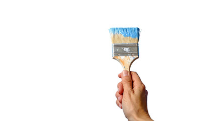 Hand holds a paint brush with blue paint on a black background