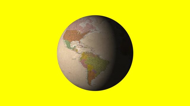 Rotating vintage globe showing continents and ocean patterns on a yellow background
