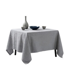 Table with bowl and vase on top of cloth
