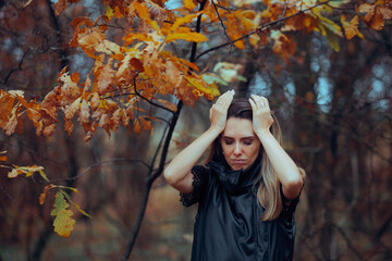 Sad Woman in Late Autumn Before the Coming of Winter. Anxious depressed person suffering from affective seasonal disorder
