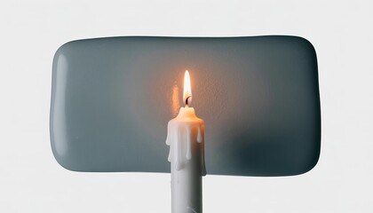 Burning white candle with melting wax against gray paint swatch isolated on white background