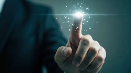 hand touching glowing light with sparkling particles