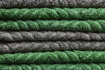 Macro Full Frame Texture of Stacked Green and Grey Patterned Towels