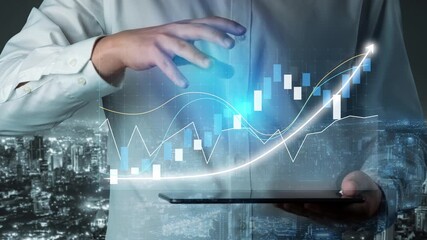 A businessman interacts with digital finance data on a tablet, showcasing growth trends over a cityscape backdrop, illustrating the fusion of technology and data analytics. Copula - Powered by Adobe