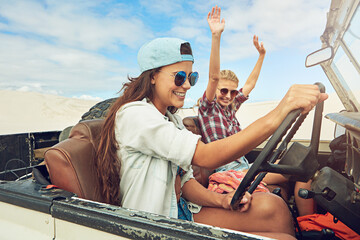 Fototapeta premium Road trip, smile and friends with truck in desert, travel holiday journey or driving on sand dunes. Outdoor adventure, bonding or happy women with sunglasses in vehicle, vacation or freedom in Dubai