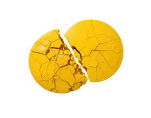 Cracked yellow sphere reveals detailed interior against a stark black backdrop