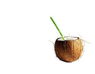Coconut half filled with white liquid, green straw against black