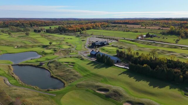 Aerial Flyover Of A Clubhouse During Fall Colours At TPC Toronto Osprey Valley Golf Course In Ontario, Canada.