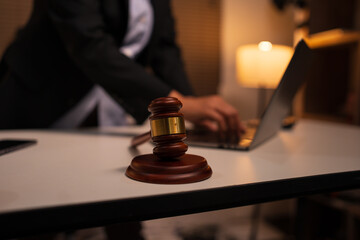 Female lawyer is working on legal documents in an office.