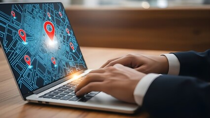 Businessman using laptop with location tracking map on screen.