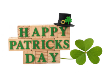 Happy st patricks day message spelled out with wooden blocks, a small leprechaun hat, and a fresh shamrock isolated on transparent background