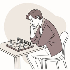 Young man thinking while playing chess at a table indoors  