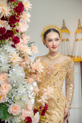 Indonesian Woman in Elegant Yellow Traditional Gown
