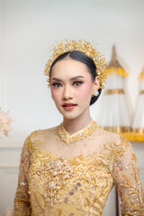 Indonesian Woman in Elegant Yellow Traditional Attire
