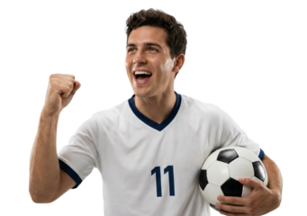 Excited young male soccer player in white jersey holding ball and cheering, isolated.