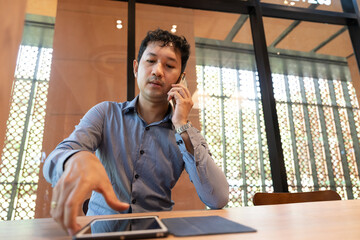 Asia business man working with tablet computer 