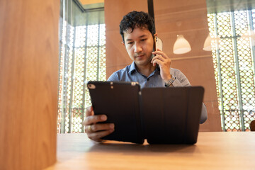 Asia business man working with tablet computer 