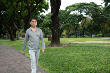 Asia elderly man exercise walk outdoor