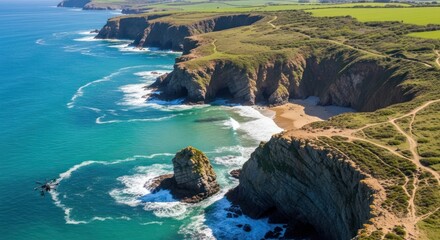 Aerial view of a scenic coastal landscape with rocky cliffs and turquoise water.