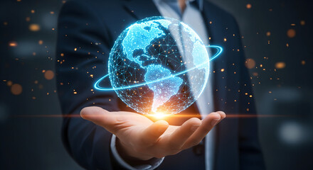 Businessman holding a glowing blue digital earth globe with network lines.