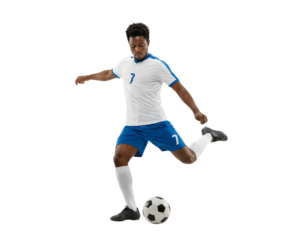 Young male soccer player in white and blue uniform kicking ball isolated on white background