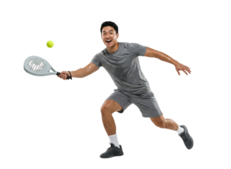 Excited Asian man playing paddle tennis, hitting a yellow ball, isolated on white background