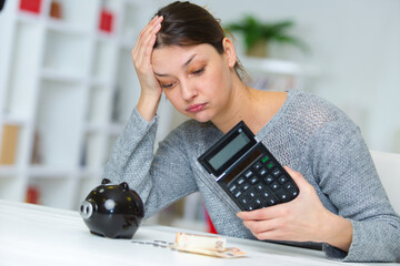 sad woman reading documents at her home