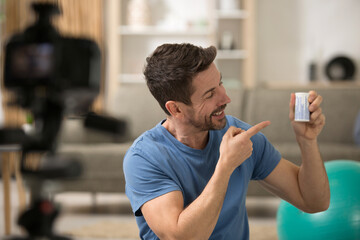 male blogger recording video in workshop