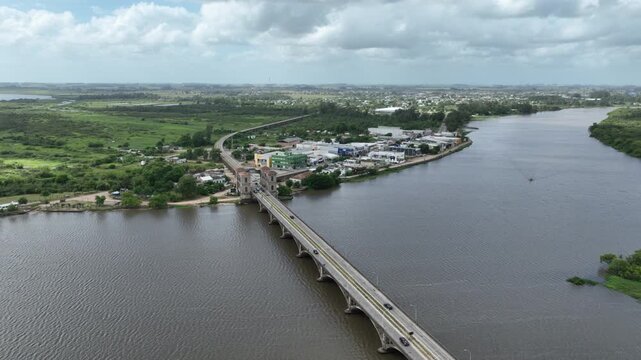 Cinematic aerial view of the entrance to the historic Maua International Bridge and border crossing district in Rio Branco Uruguay on the frontier with Brazil.