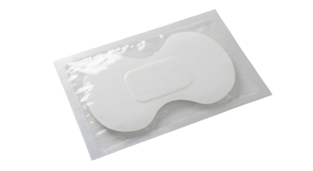 White medicine patch sits in sealed package on black. Use for product display, medical backdrop, or branding materials.
