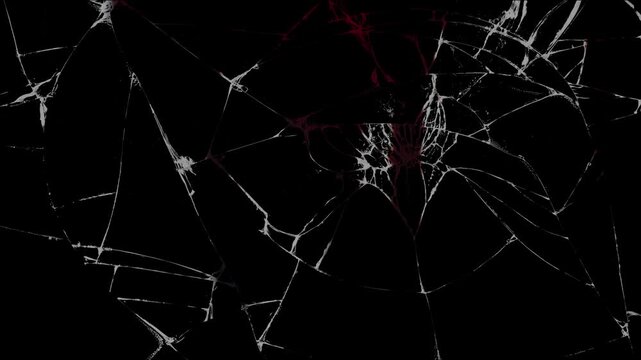 Red blood slowly drips down a windshield shattered in a car accident, creating a somber and suspenseful visual of the tragic consequences on a black background