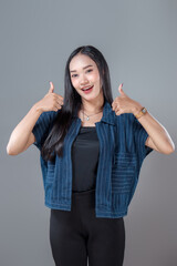 Smiling Asian Woman Showing Double Thumbs Up