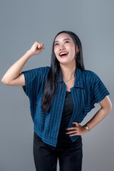 Happy Asian Woman Celebrating With Raised Fist