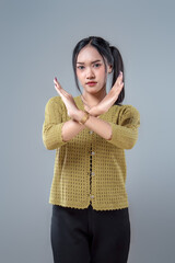 Asian Woman Showing Crossed Stop Gesture