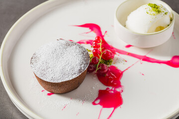 Warm chocolate lava cake with flowing center and powdered sugar