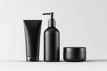 Set of sleek black cosmetic products on white background