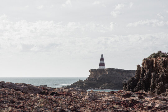 Old red and white striped Obelisk (lighthouse) in Robe