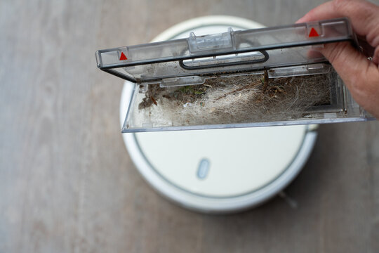 the dust bin of a robot vacuum with mostly dog hair