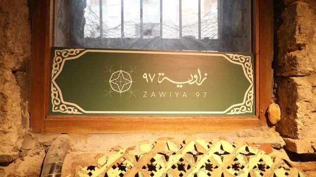 Close-up of Zawiya 97 cultural project sign in Al-Balad, Jeddah