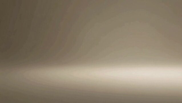 Subtle gradient studio background with soft illumination, creating an empty and minimalist stage perfect for product photography or abstract design concepts