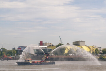 Fireboat spraying water at Port anniversary in Hamburg Landungsbr�cken
